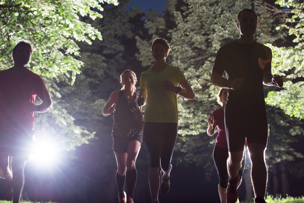 Runners at night on road